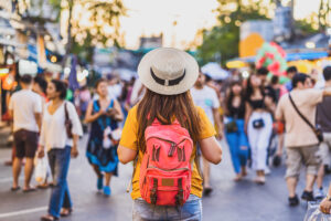 Back side of Young Asian traveling women walking and looking in