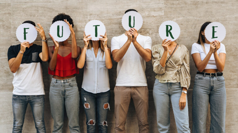 Group of young people hiding their face with the world Future -